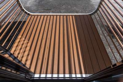 Ekodeck composite decking installed on our SPACEE Deck accessory with a white painted steel frame.