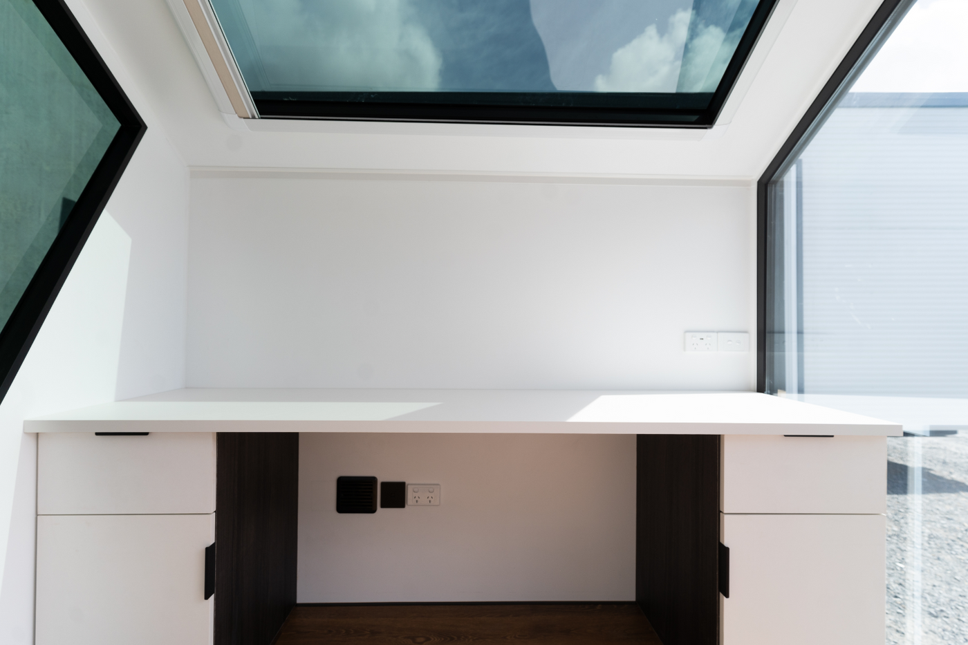 Desk space with sky light roof window.