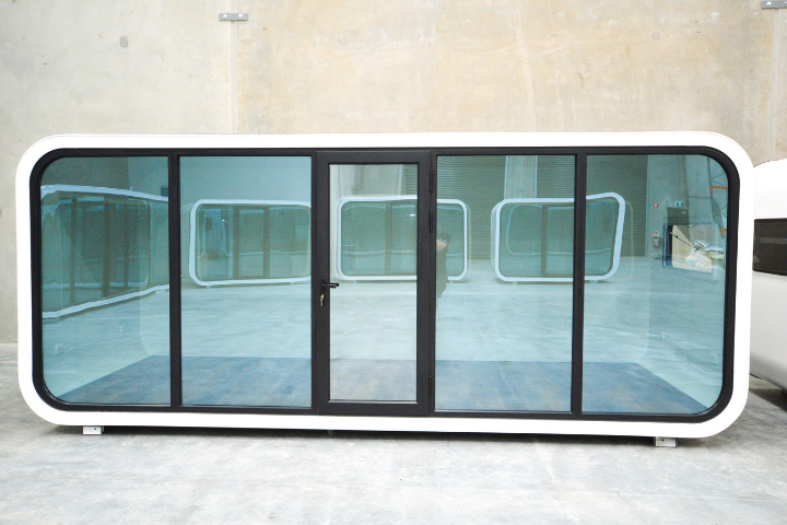 BigBox Spacee design exterior in white with mirrored window doors and black door frame with lockable front door.