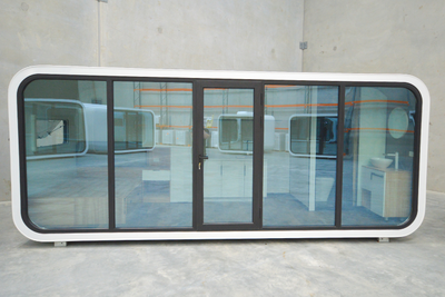 WhiteHouse Spacee design exterior in white with mirrored glass doors and black door frames with lockable door.