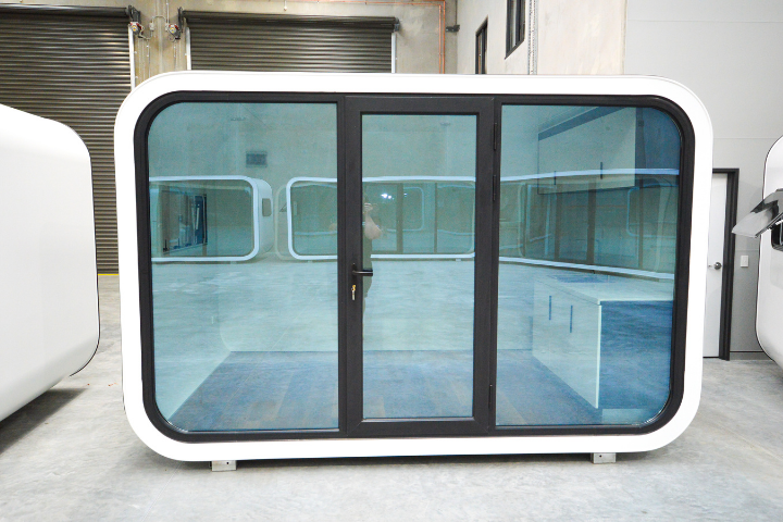 Eat Spacee design exterior in white with mirrored glass doors and black door frames.