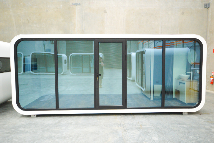 Wash Spacee design exterior in white with mirrored glass doors and black door frames