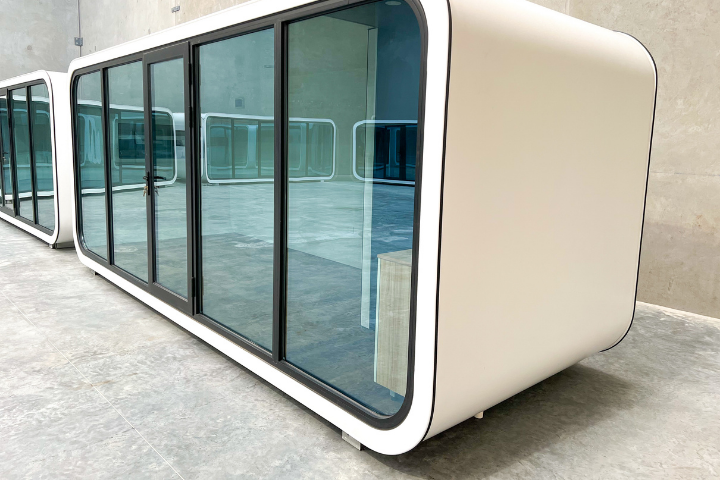 Wash Spacee design exterior in white with mirrored glass doors and black door frames