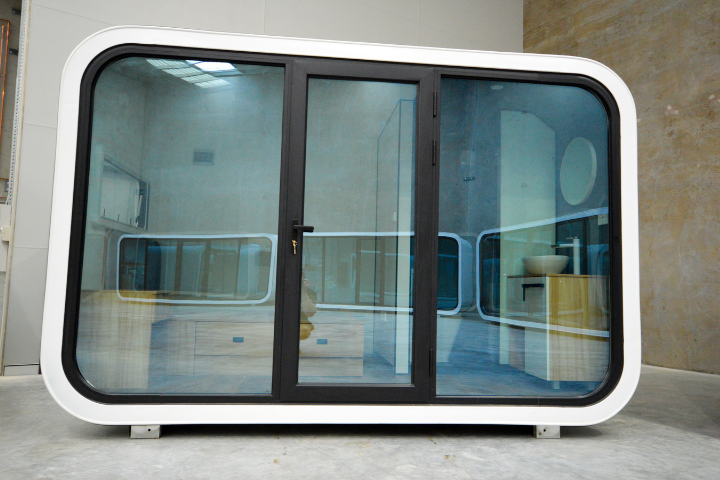 Rest Spacee design exterior in white with mirrored glass doors and black door frames.